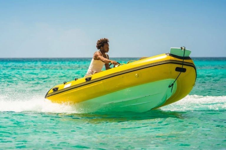 a-black-man-driving-a-yellow-RIB-with-heavy-hull-on-ocean-768x512.jpg